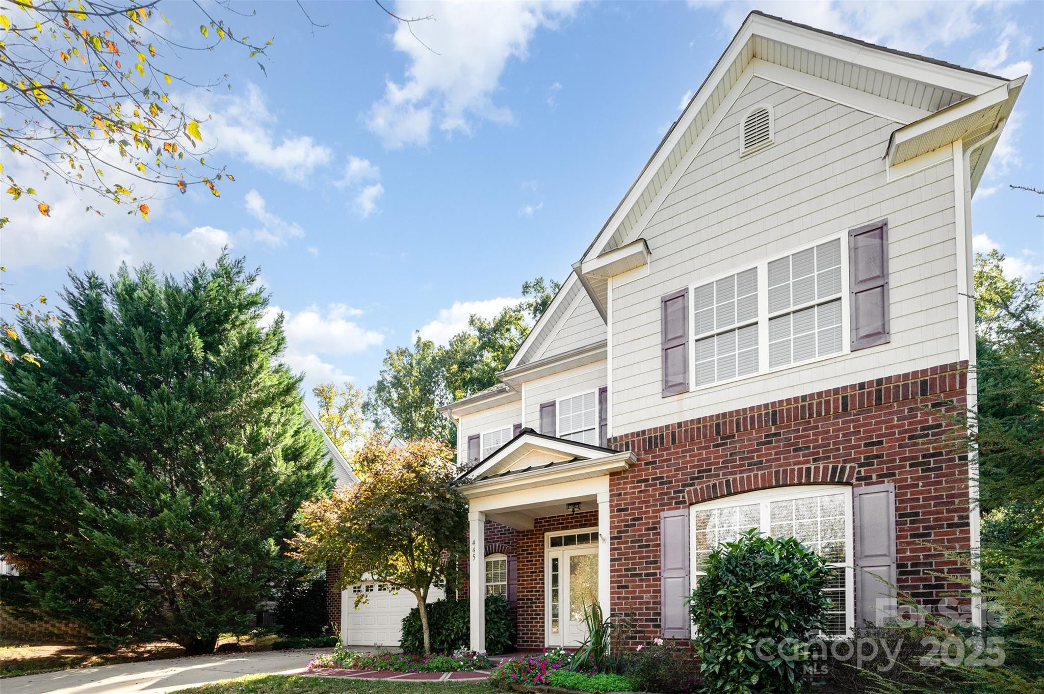 445 Buttermere Road Fort Mill, SC 29715 - Photo 2 of 35 a front view of a house with a garden