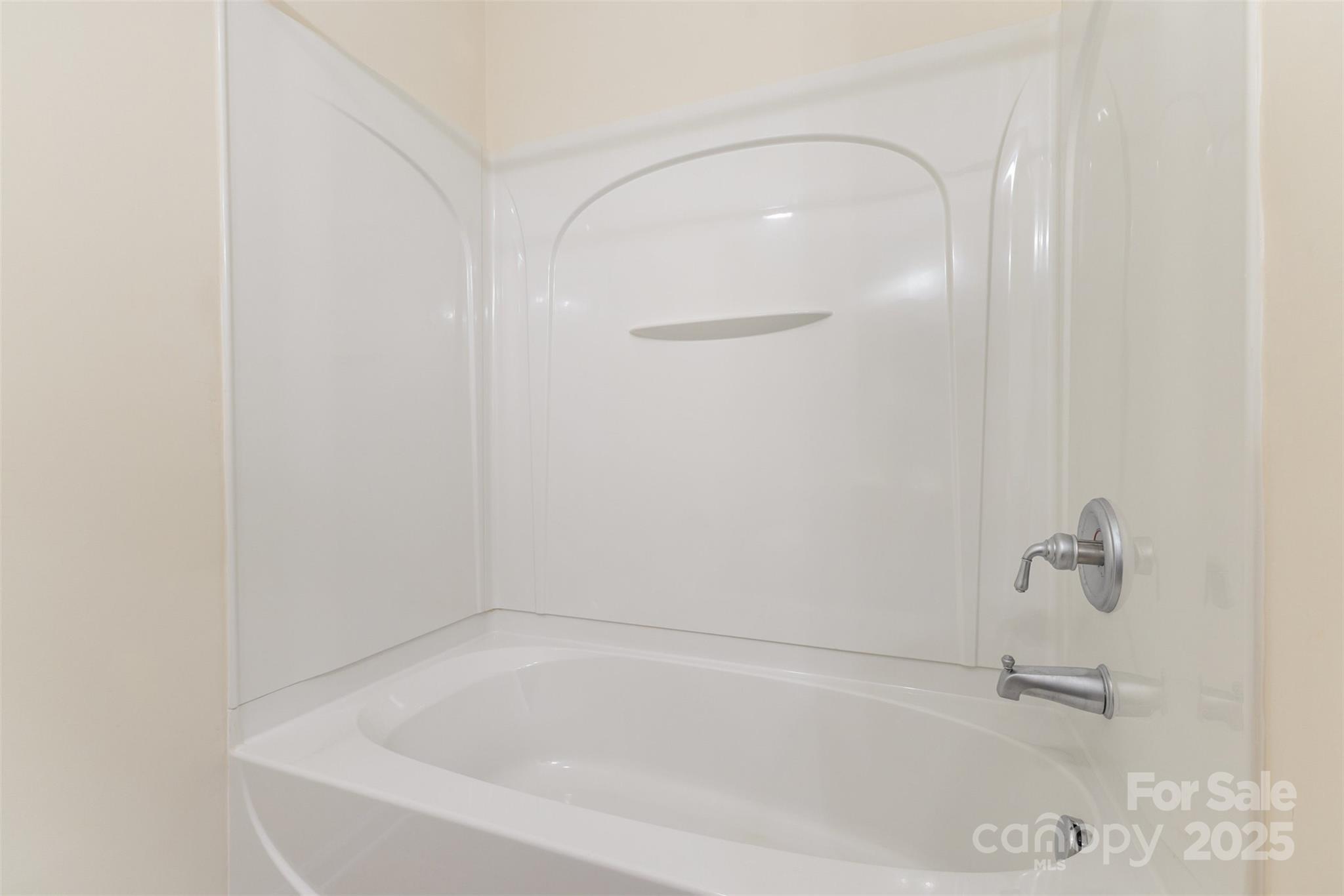 445 Buttermere Road Fort Mill, SC 29715 - Photo 24 of 42 a white bath tub sitting next to a white sink and vanity