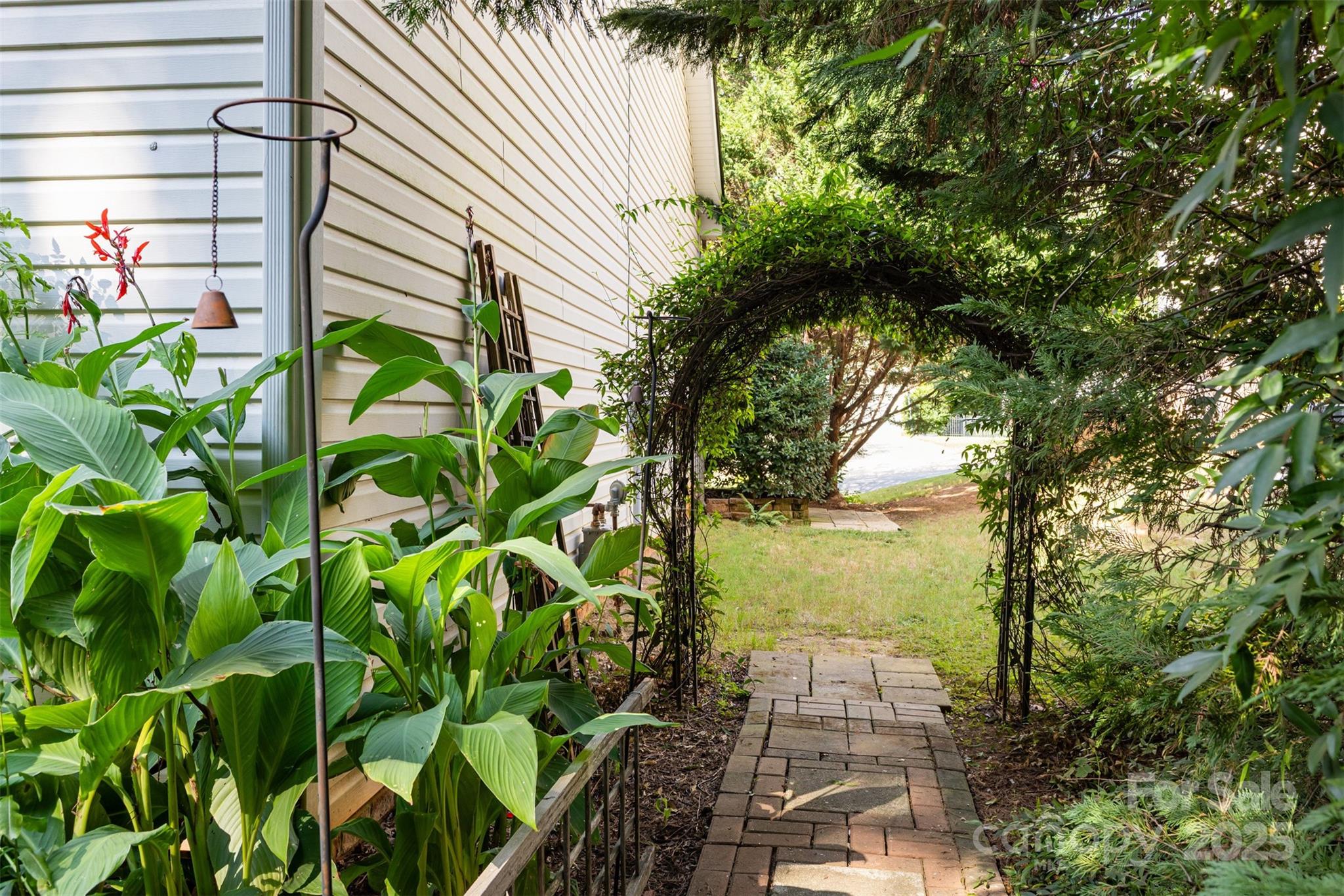 445 Buttermere Road Fort Mill, SC 29715 - Photo 26 of 35 a view of a yard with plants and large trees