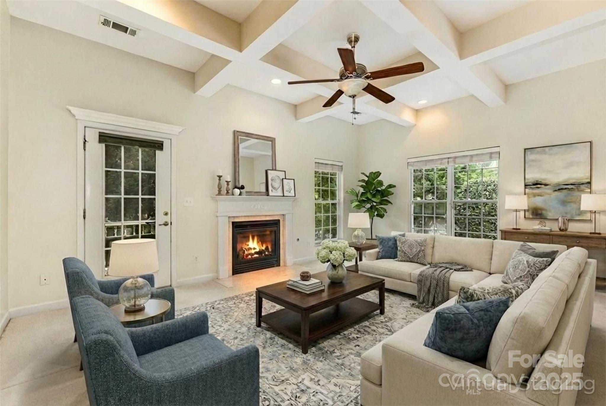 445 Buttermere Road Fort Mill, SC 29715 - Photo 3 of 42 a living room with furniture and a fireplace