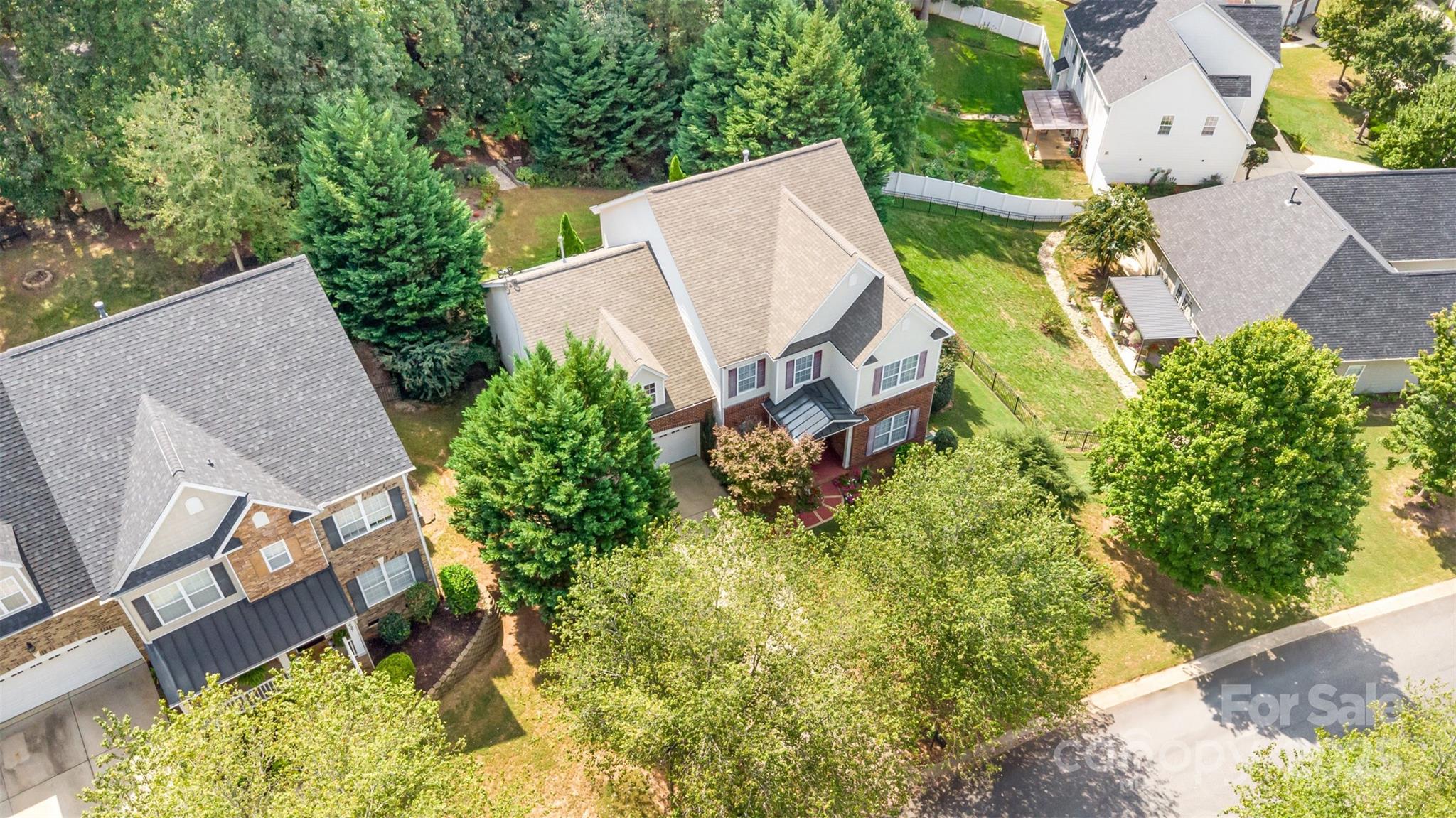 445 Buttermere Road Fort Mill, SC 29715 - Photo 33 of 35 an aerial view of a house with a yard and plants