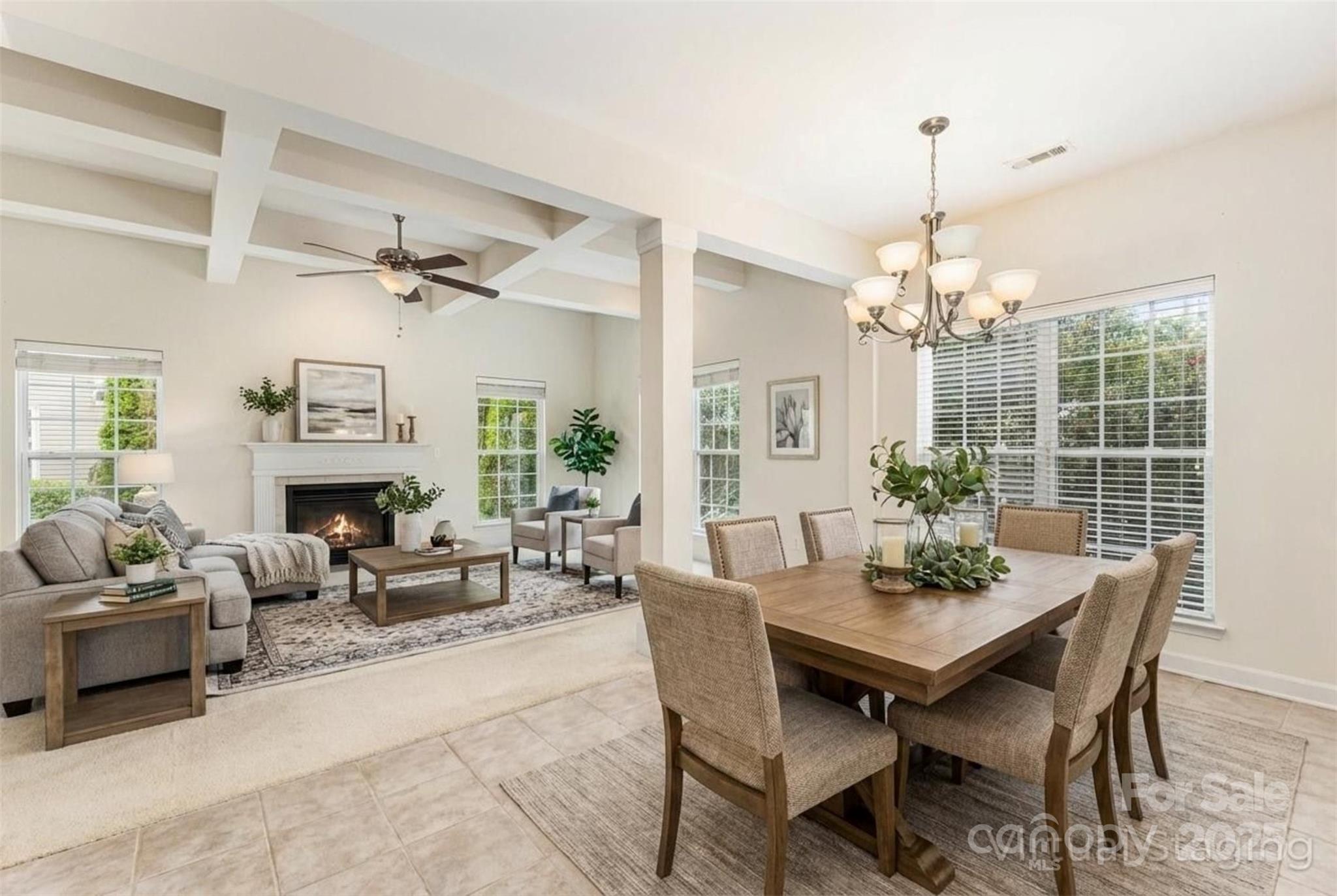 445 Buttermere Road Fort Mill, SC 29715 - Photo 5 of 42 a view of a dining room with furniture window and wooden floor
