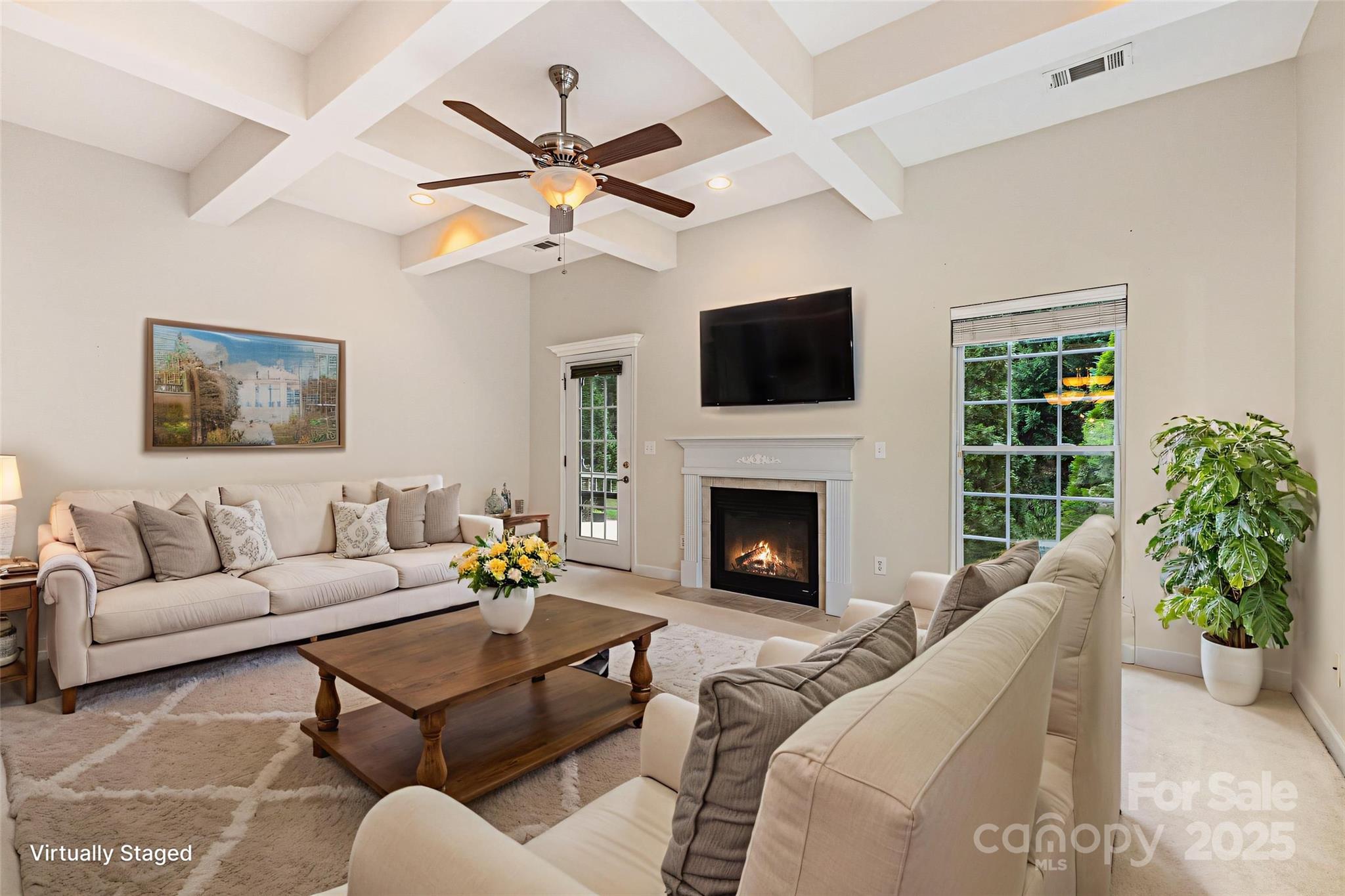 445 Buttermere Road Fort Mill, SC 29715 - Photo 10 of 35 a living room with furniture a fireplace and a flat screen tv