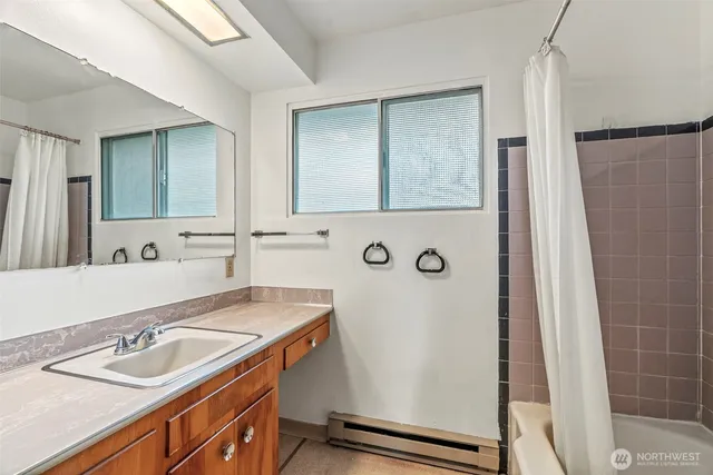 a bathroom with a sink and a mirror
