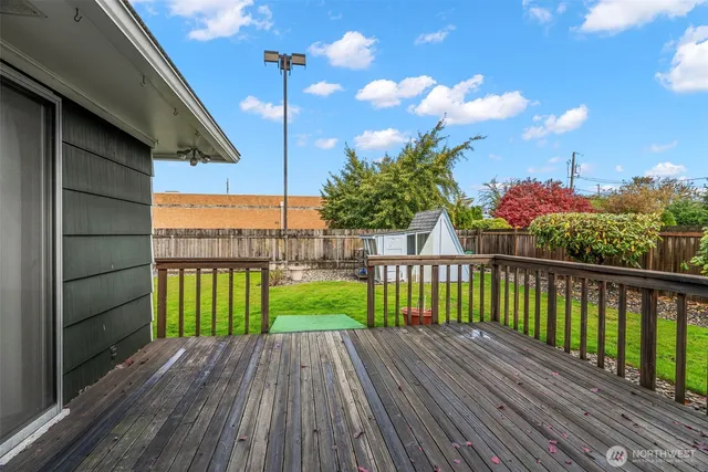 a view of a balcony with wooden floor