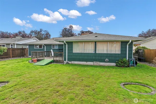 a view of a house with a yard porch and sitting area