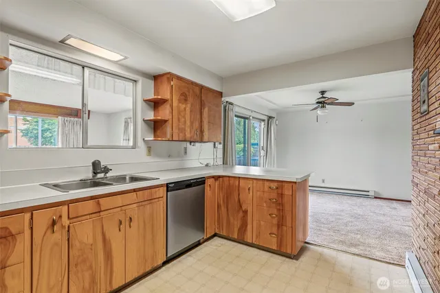 a kitchen with a sink stove and cabinets