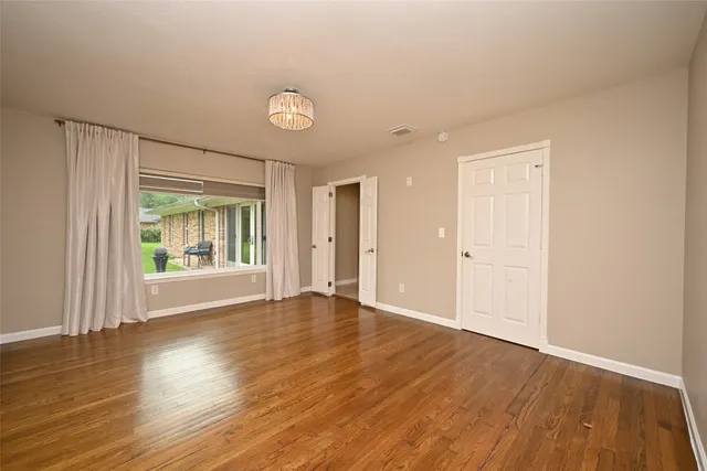a bathroom with a double vanity sink toilet mirror and bathtub