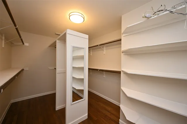a bathroom with a bathtub sink and mirror