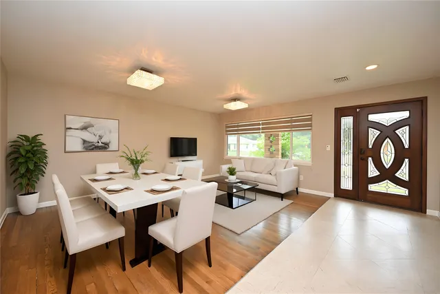 a living room with furniture and a window