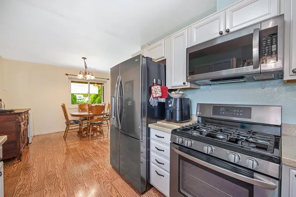 a kitchen with a stove and a microwave