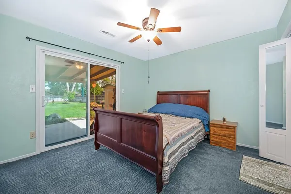 a bedroom with a bed and window