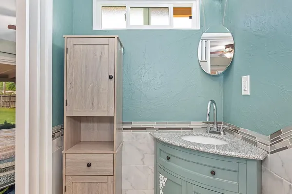 a bathroom with a sink and a mirror