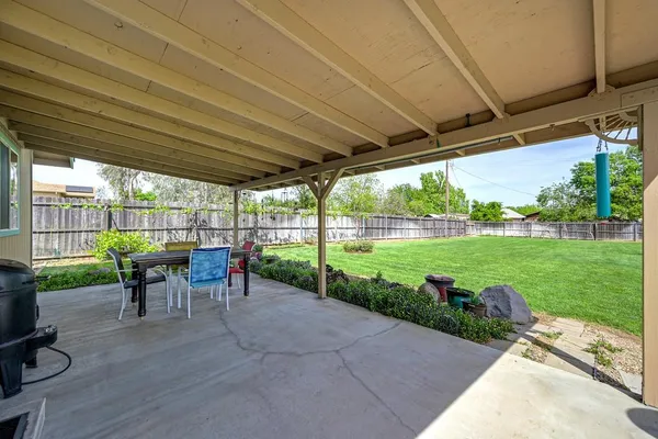 a view of a tables and chairs in the patio