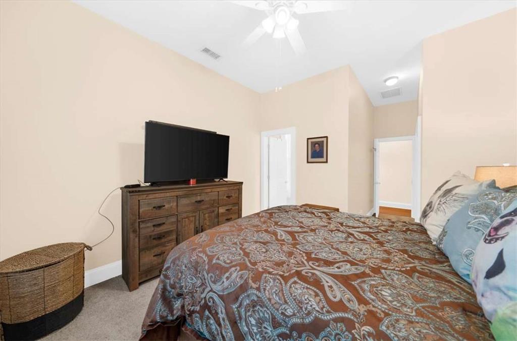106 Westmore Road Southwest Rome, GA 30165 - Photo 35 of 56 a bedroom with a bed and a flat screen tv