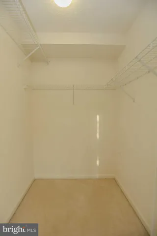 a work room with furniture and a potted plant