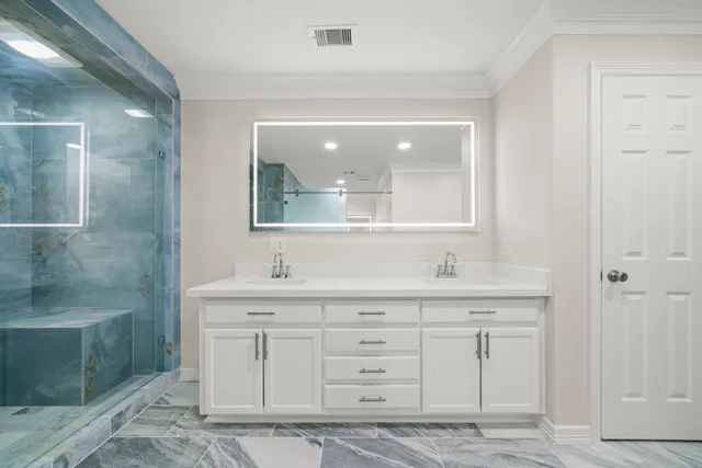 a bathroom with a sink and a mirror