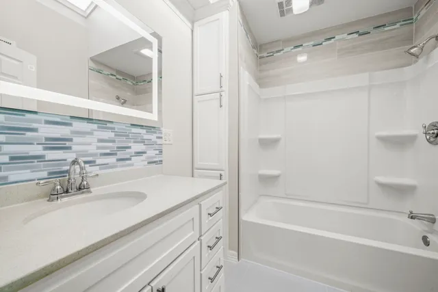 a bathroom with a shower and a bath tub
