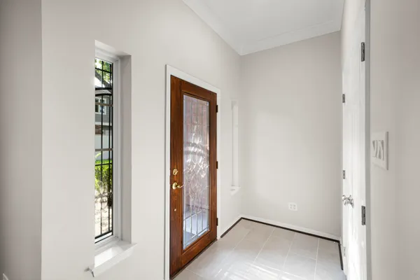 a view of an empty walk in closet with empty racks