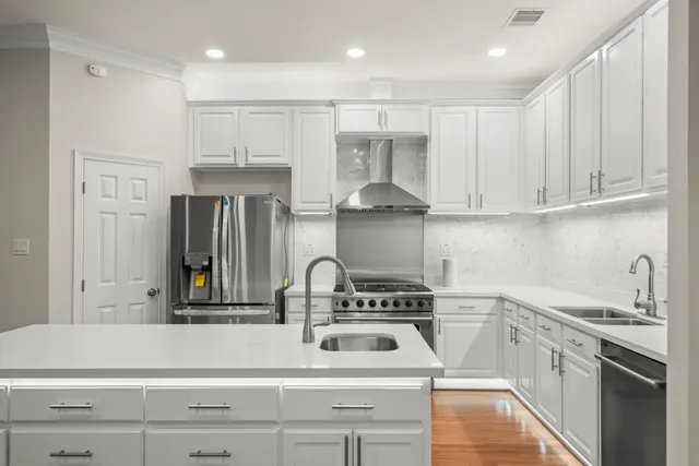 a kitchen with a sink stove and refrigerator