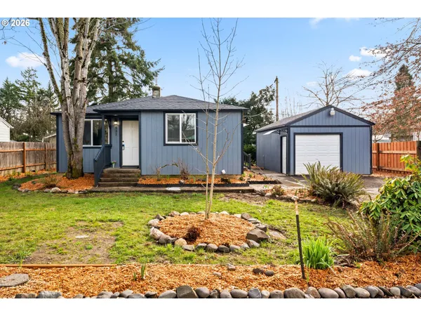 a view of a house with swimming pool and a yard