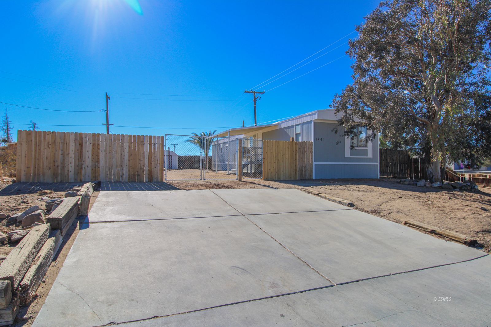1441 West Iowa Avenue Ridgecrest, CA 93555 - Photo 1 of 27 a backyard of a house