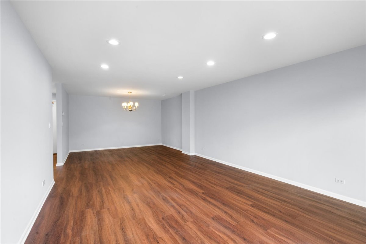 1795 Lake Cook Road, Unit 107 Highland Park, IL 60035 - Photo 8 of 26 a view of empty room with wooden floor