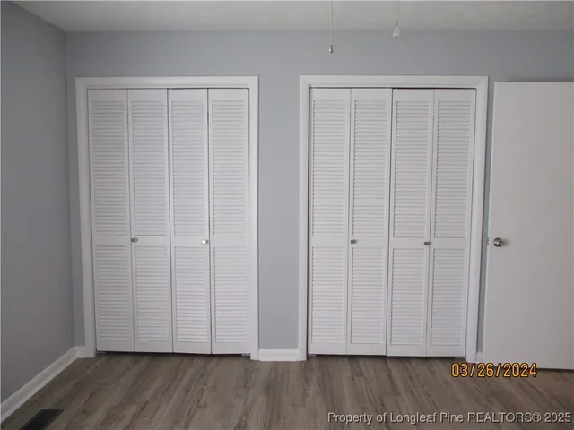 a view of a livingroom with wooden floor