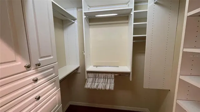 a bathroom with a double vanity sink a toilet and a shower