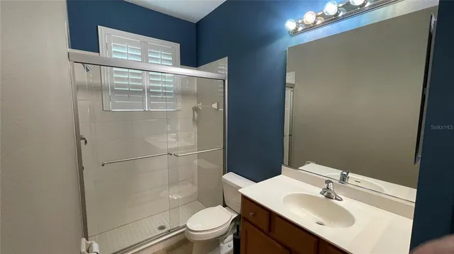 an aerial view of a houses with outdoor space and street view