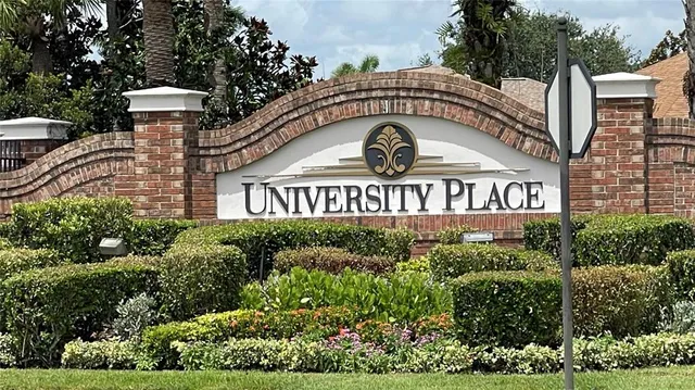 a front view of a house with garden and plants