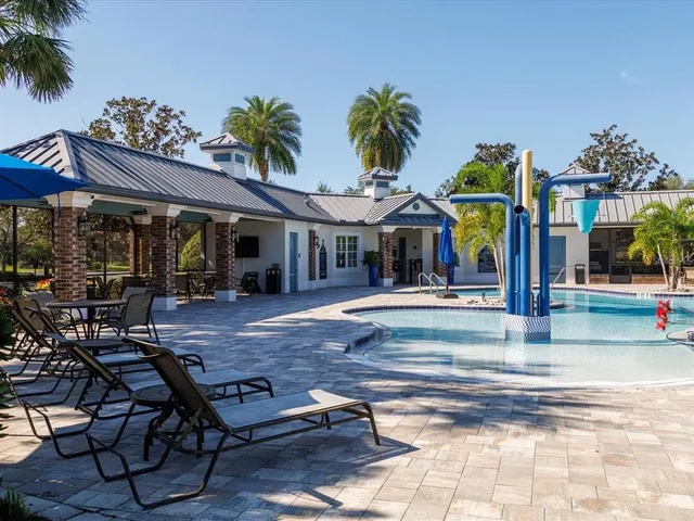 a view of a park with large trees
