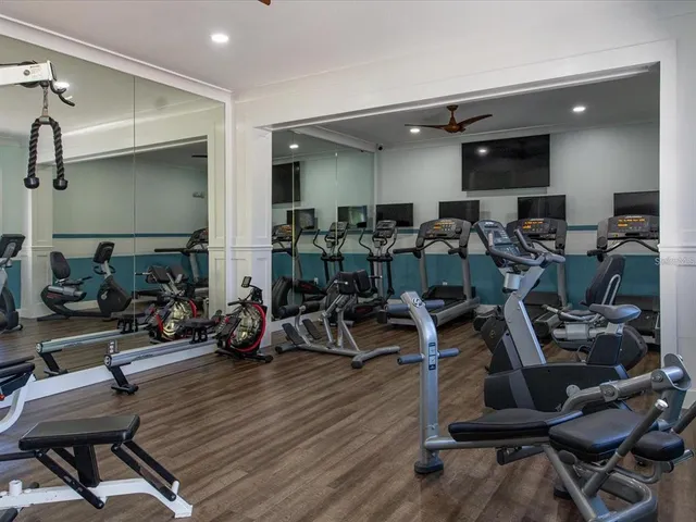 a front view of a house with swimming pool garden and patio