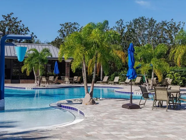 a front view of a house with yard and green space