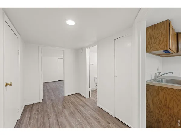 a living room with furniture and a dining table