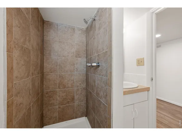 a bathroom with a sink vanity and a mirror