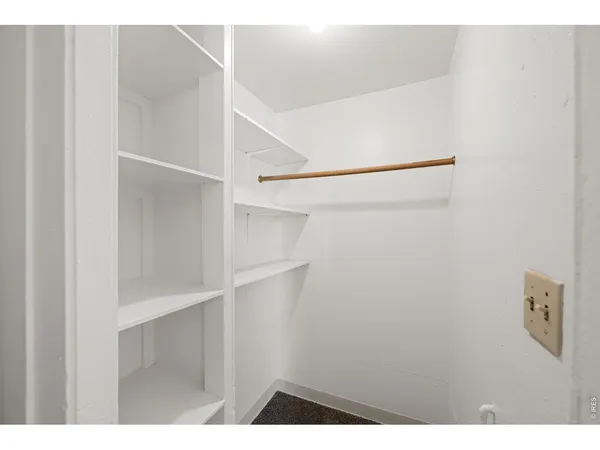 a bedroom with furniture and a bed