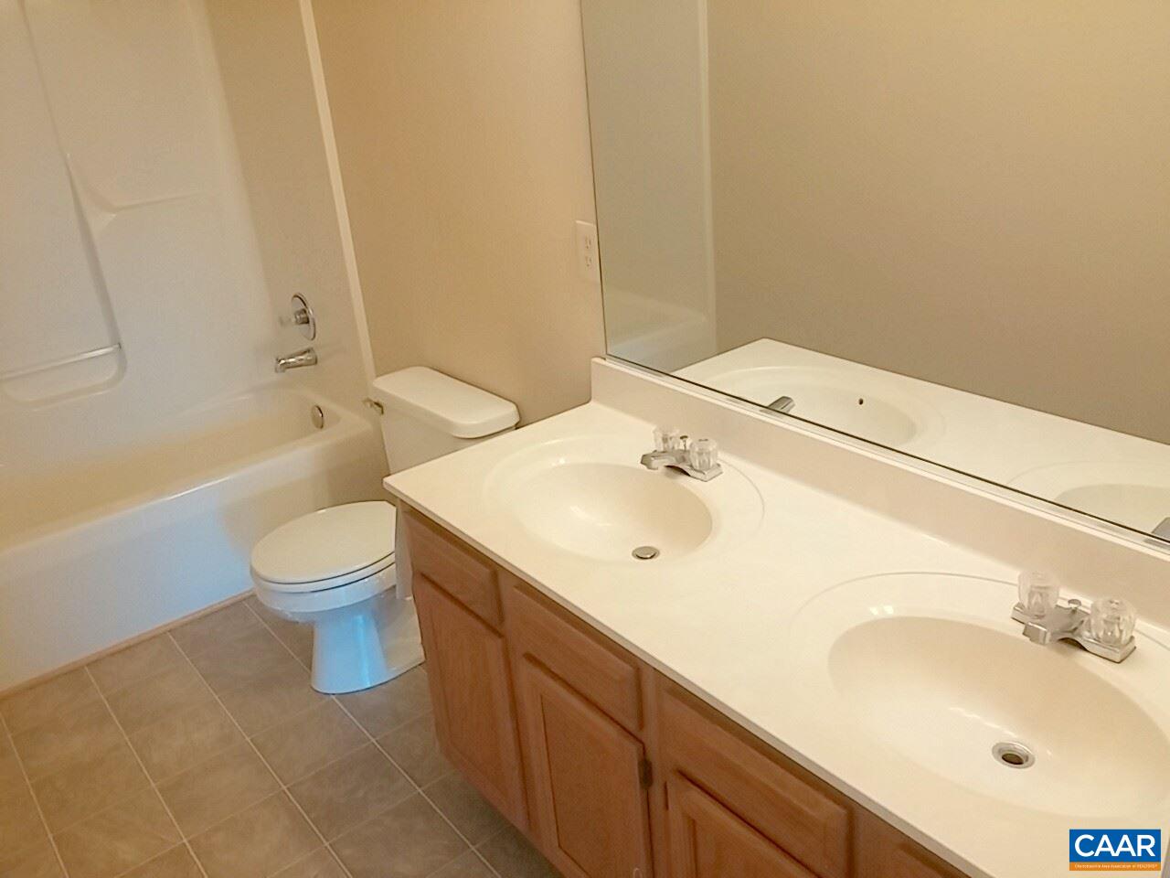 209 Jonquil Road Ruckersville, VA 22968 - Photo 8 of 14 a bathroom with a sink a toilet and shower