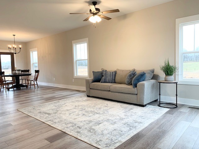 6076 Brown Road Springfield, TN 37172 - Photo 3 of 17 a living room with furniture and a wooden floor