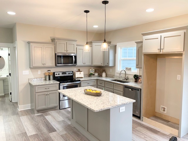 6076 Brown Road Springfield, TN 37172 - Photo 4 of 17 a kitchen with a stove a sink and a refrigerator