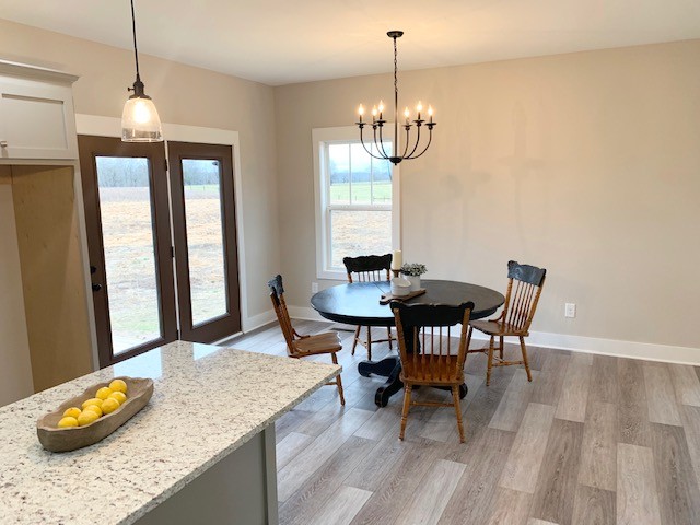 6076 Brown Road Springfield, TN 37172 - Photo 6 of 17 a view of a dining room with furniture window and wooden floor