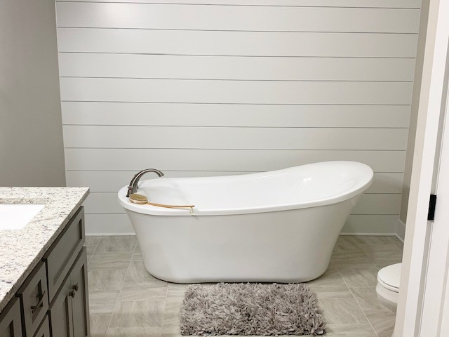 6076 Brown Road Springfield, TN 37172 - Photo 9 of 17 a white bath tub sitting in a bathroom