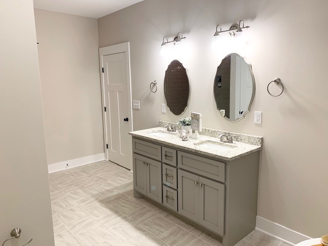 6076 Brown Road Springfield, TN 37172 - Photo 10 of 17 a bathroom with double vanity sink and mirror