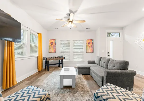 a living room with furniture and a window