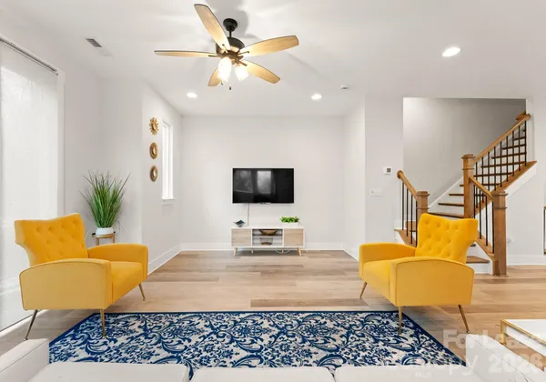 a bedroom with furniture and a lamp
