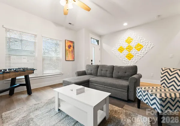 a living room with furniture and a window