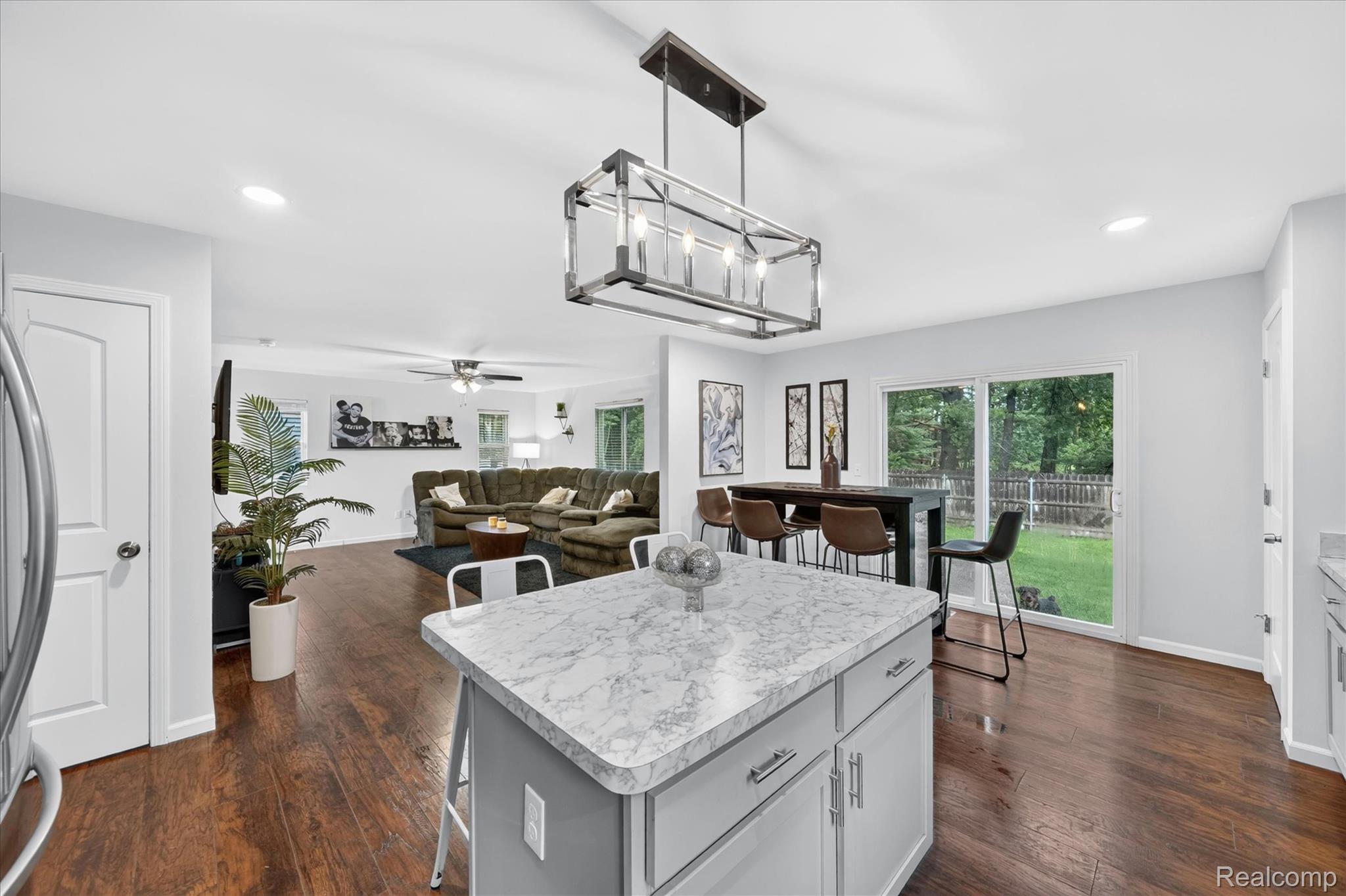 5382 Rural Terrace Waterford, MI 48329 - Photo 15 of 35 Kitchen island featuring a light-toned countertop and cabinet storage
