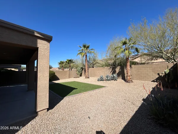 a view of a backyard of the house