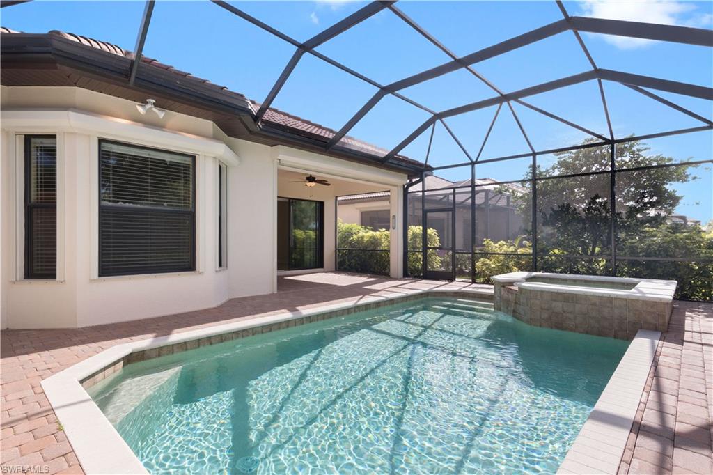7389 Moorgate Point Way Naples, FL 34113 - Photo 20 of 23 Screened Lanai with Pool/ Spa