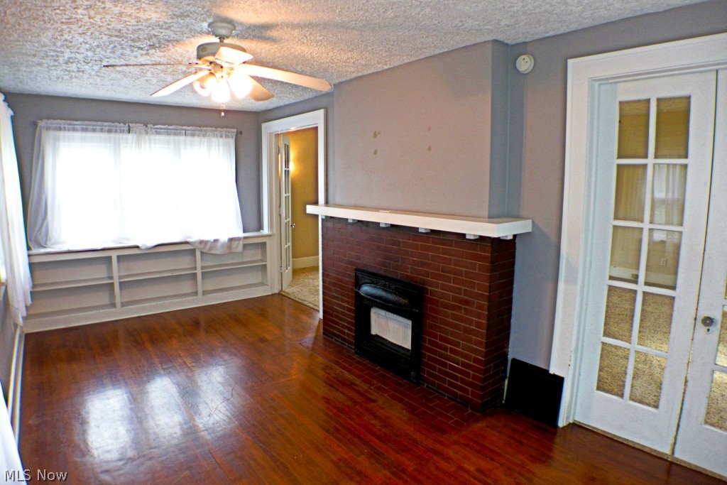 1403 Ridge Road Northwest Canton, OH 44703 - Photo 5 of 20 Another view in the sunroom with faux fireplace